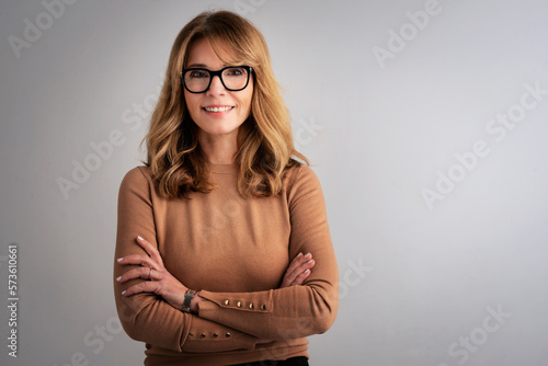 Wallpaper Mural Studio portrait of an attractive middle age woman against grey background Torontodigital.ca