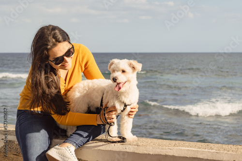 Young woman enjoying a walk with her dog, outdoor family