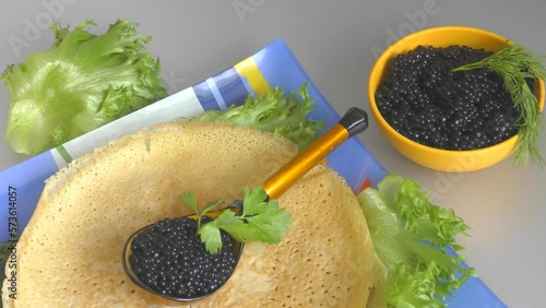 Pancakes with black caviar, cooked for Maslenitsa. Maslenitsa is an East Slavic traditional holiday celebrated during the week before Lent.