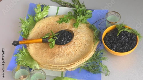 Pancakes with black caviar, cooked for Maslenitsa. Maslenitsa is an East Slavic traditional holiday celebrated during the week before Lent.