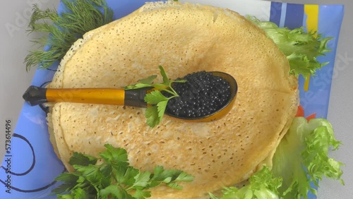 Pancakes with black caviar, cooked for Maslenitsa. Maslenitsa is an East Slavic traditional holiday celebrated during the week before Lent.