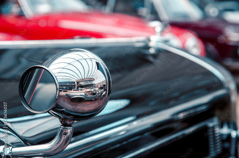 intresting view with reflect on a large mirror in a beautiful original old car. Retro