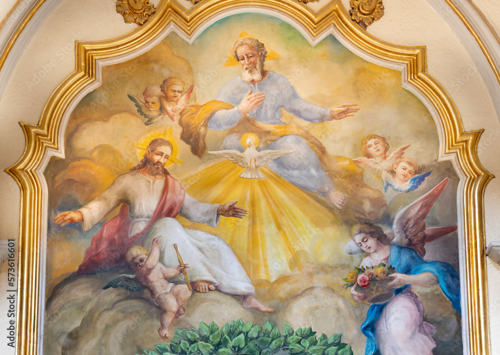 VALENCIA, SPAIN - FEBRUAR 17, 2022: The fresco of Holy Trinity  in the church Iglesia de San Marítn from 20. cent.