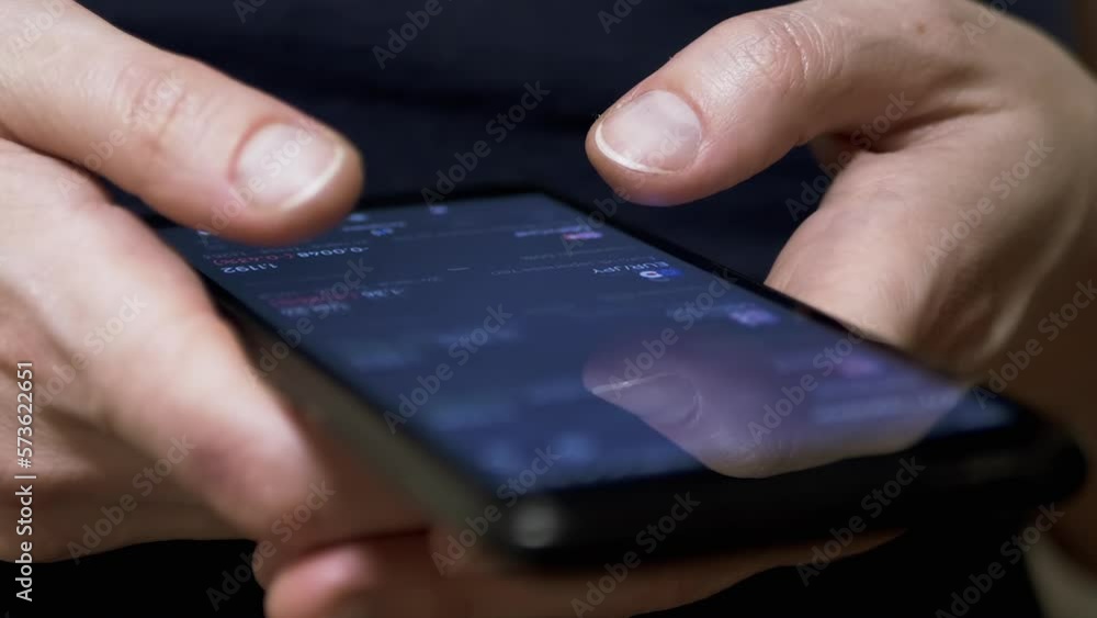 Investor Checks Price of Cryptocurrency on Touch Screen of a Mobile Phone. Fingers touch screen of a smartphone. Mobile app. Cryptocurrency pairs, bitcoin. Stock exchange data. Growth, fall of crypto. Investor Checks Price of Cryptocurrency on Touch Screen of a Mobile Phone. Fingers touch screen of a smartphone. Mobile app. Cryptocurrency pairs, bitcoin. Stock exchange data. Growth, fall of crypto.