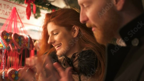 Winter holidays - happy young couple on Christmas evening, marriage proposal
