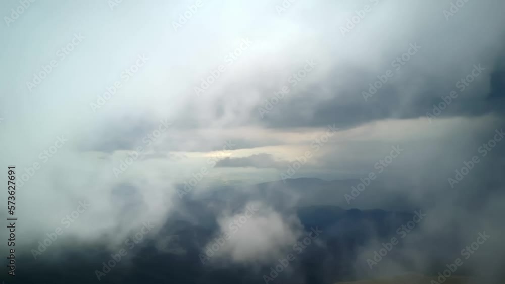 View of clouds over the mountains View of clouds over the mountains
