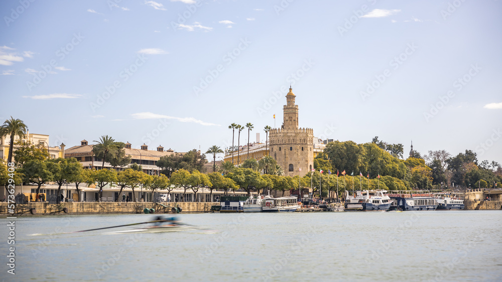 View of the Torre del Oro in Seville from the Guadalquivir river on a spring day View of the Torre del Oro in Seville from the Guadalquivir river on a spring day