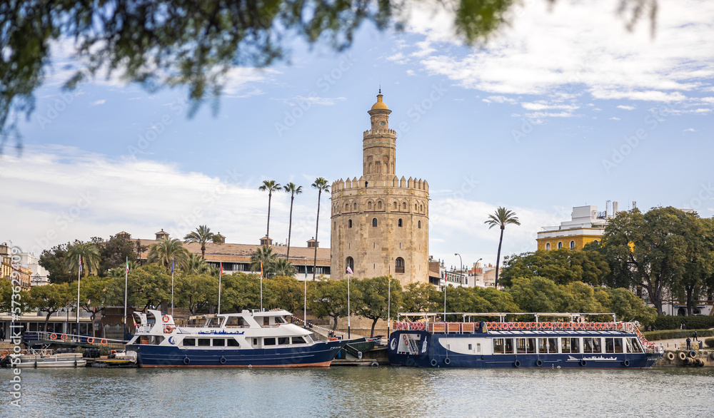 View of the Torre del Oro in Seville from the Guadalquivir river on a spring day
