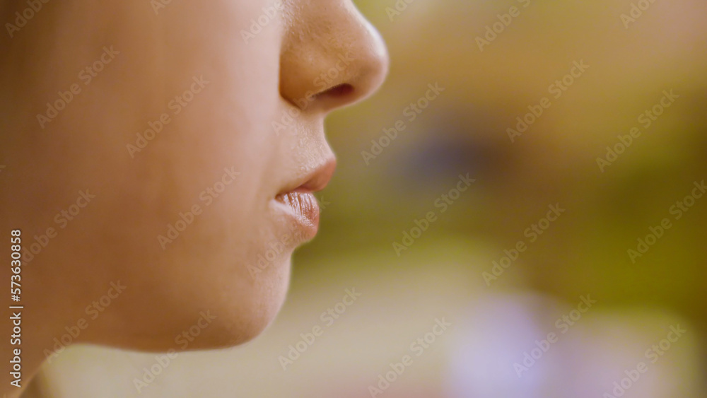 Close up of girl with red lips eating Close up of girl with red lips eating
