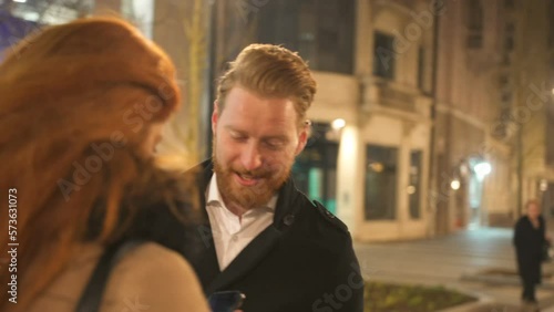 Winter holidays - happy young couple on Christmas evening, marriage proposal