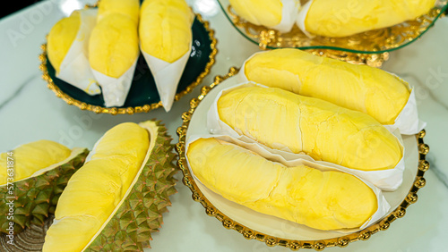 Close up durian flesh yellow gold . Bright yellow tropical fruit