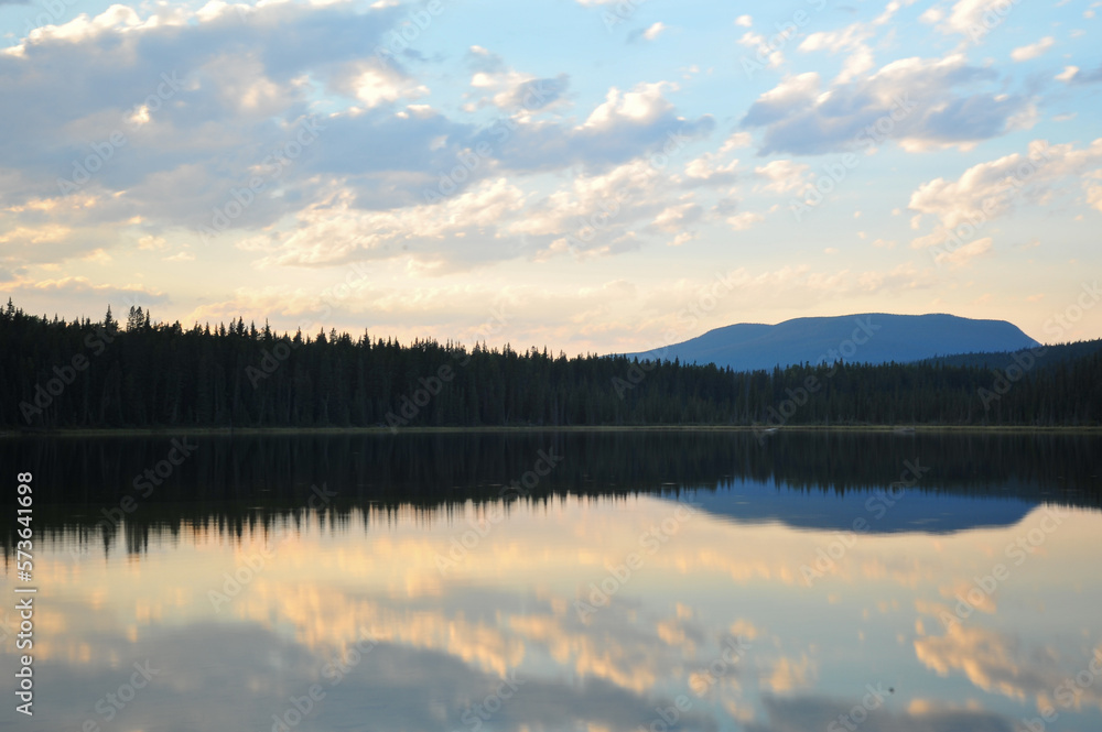 Fototapeta premium pink colored clouds at sunset over Goldeye lake campground near Nordegg, Alberta, Canada