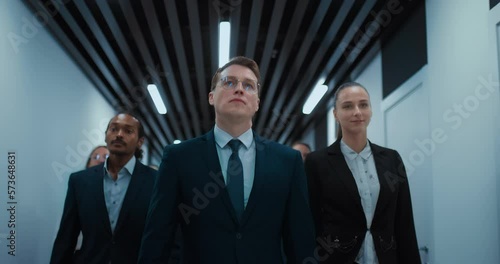 multiethnic business team of confident businesspeople walking in corridor of office center, 4K, Prores