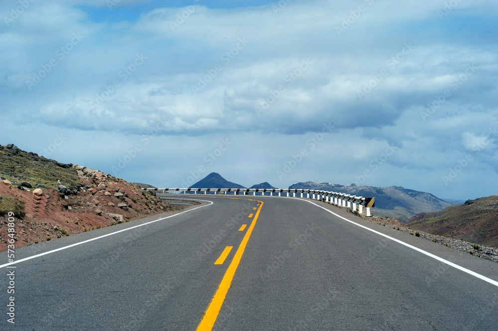Naklejka premium ayacucho peru mountain with curve on the road with asphalt in blue sky may 2020