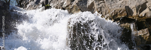 River flowing through rocks and stones closeup © megaflopp