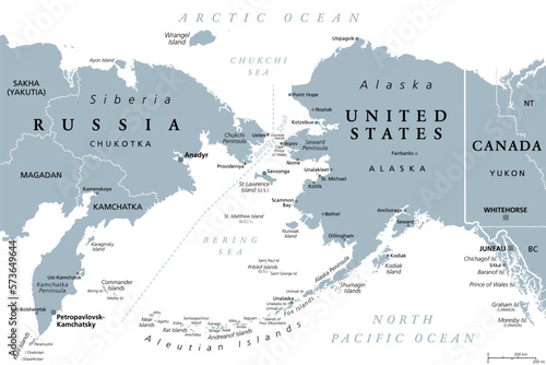 Russia and United States, maritime boundary, gray political map. The Chukchi Peninsula of Russian Far East, and Seward Peninsula of Alaska, separated by Bering Strait between Pacific and Arctic Ocean. photo