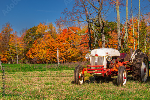 old tractor in autumn landscape