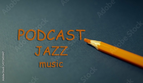Cover, background for a music podcast. Retro blue background with orange pencil lettering. Selective focus.
