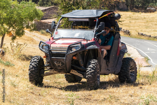 Adventurous retiree exploring the countryside in a 4x4 utv buggy quad photo