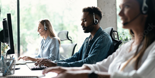Team of business people working in a call centre on the line.