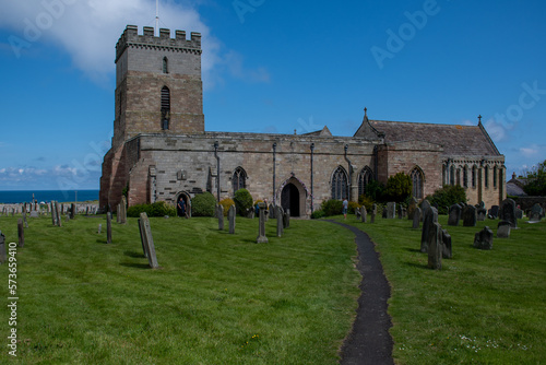 The exterior of St Aidan's Church and churchyard in Bamburgh, Northumberland, UK photo