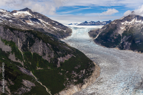 Aerial view of the Norris Glacier, as it makes its way down out of the mountains near Juneau, Alaska. 