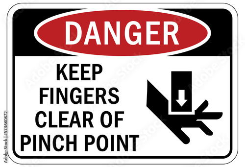 Pinch point hazard sign and labels keep fingers clear of pinch point photo