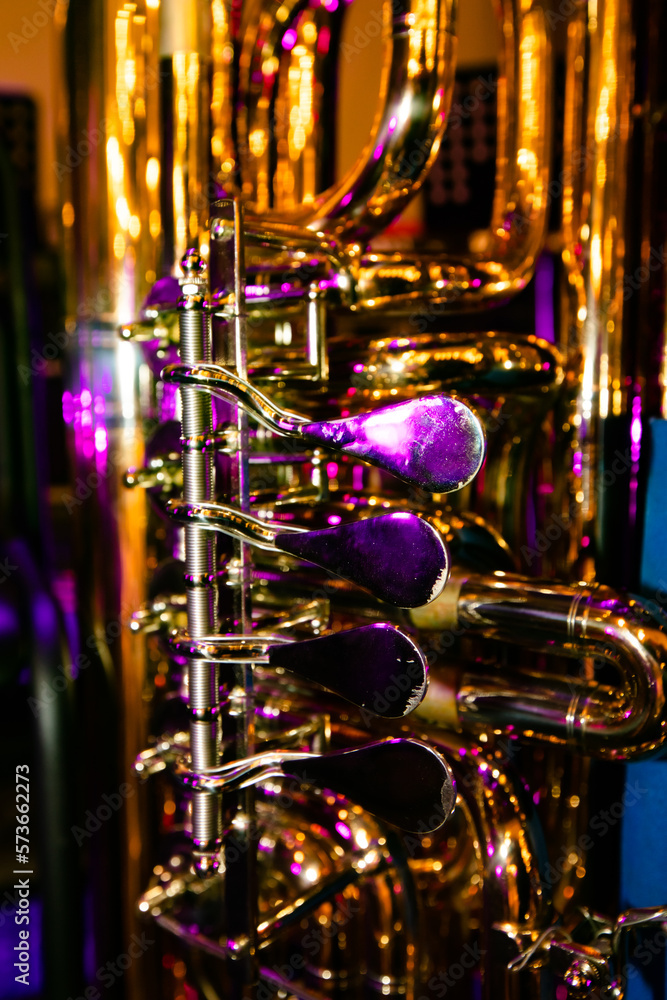 Closeup of French horn in concert lights