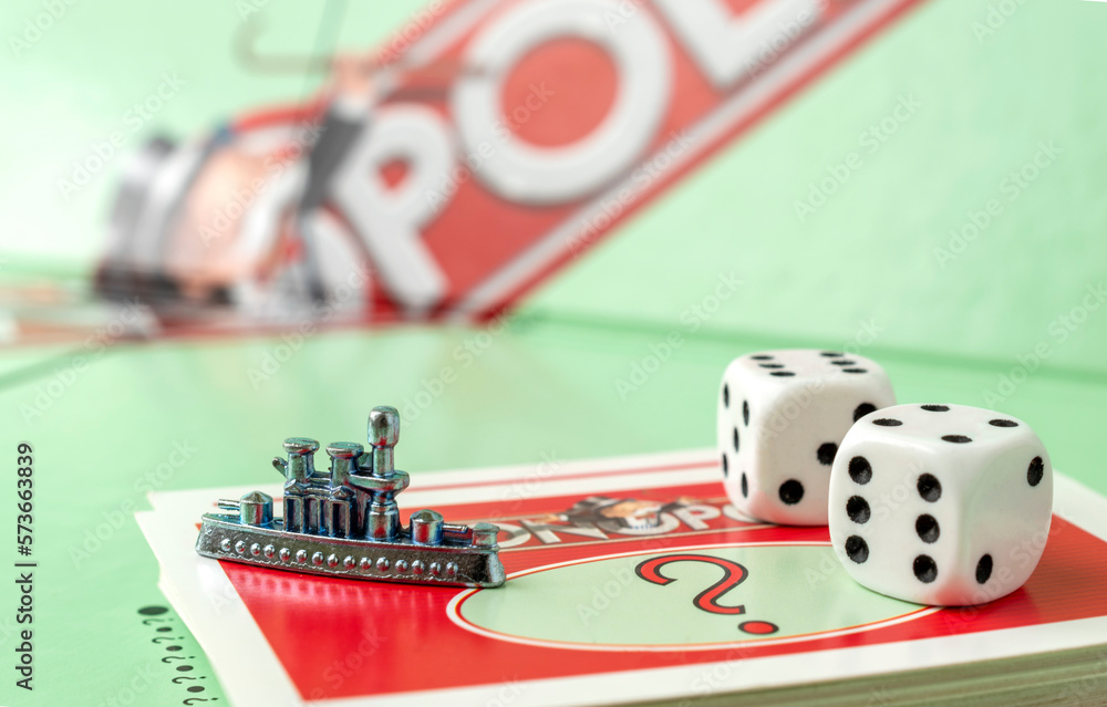 Kaunas, Lithuania - July 2022: close up of monopoly ship token, monopoly  board and dices on the monopoly chance cards. Stock Photo | Adobe Stock