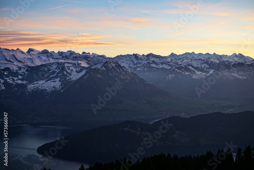 Orange sunset on alpine mountains and lake 