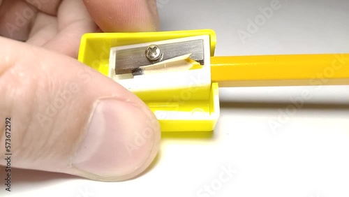 pencil sharpening macro. pencil sharpener and shavings close-up view