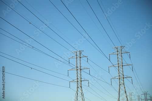 Electrical cables and power station lines for electricity in the blue sky 