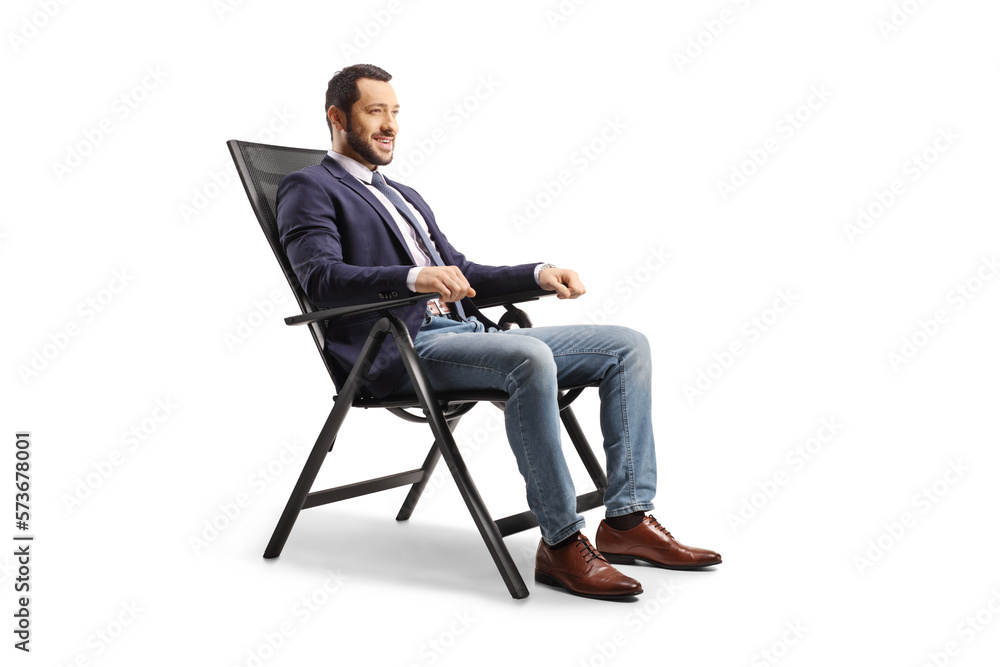 Young man resting in a foldable chair Young man resting in a foldable chair