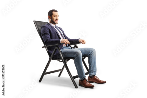 Young man resting in a foldable chair