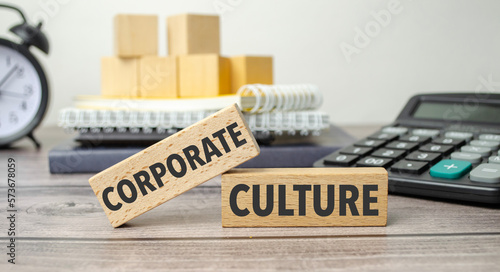 corporate culture on the work table and alarm clock