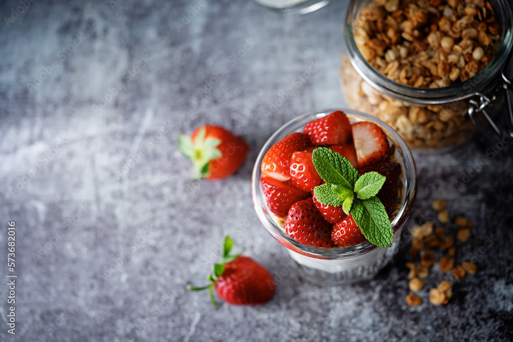 Strawberry Greek yogurt granola parfait in a glass Strawberry Greek yogurt granola parfait in a glass