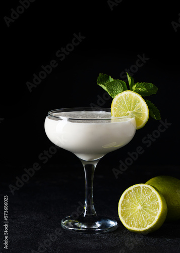 Coconut alcoholic drink with slice of lime