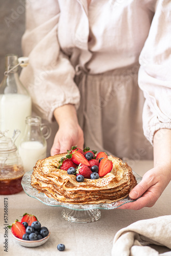 Sweet french and russian style homemade pancake crepes with berries.