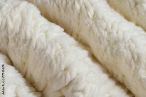 Closeup of a soft white material, woolen texture, fluffy and cozy, winter mood, Creamy Knitted Texture