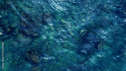 Blue water texture. Top view of the ocean surface with waves