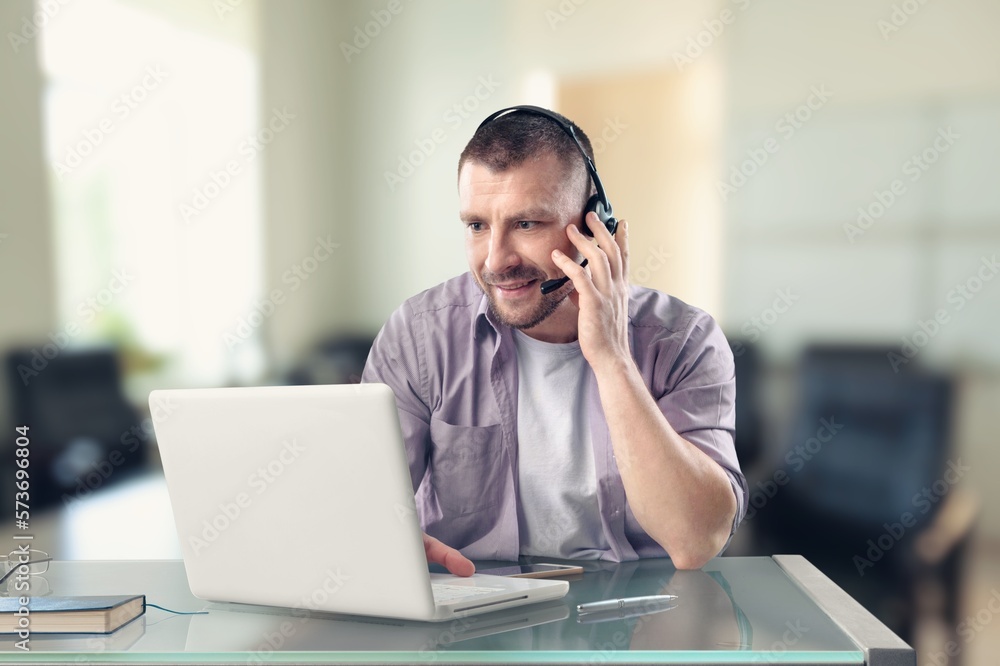 Smiling young business man employer in office Smiling young business man employer in office