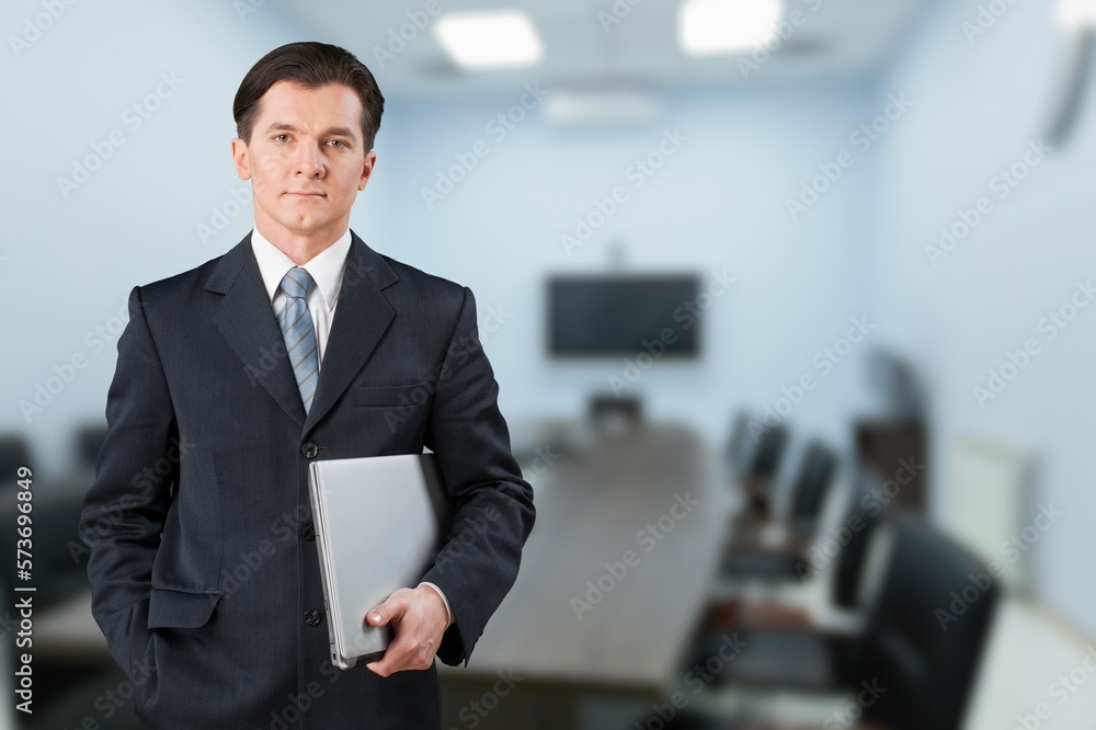 Smiling young business man employer in office Smiling young business man employer in office