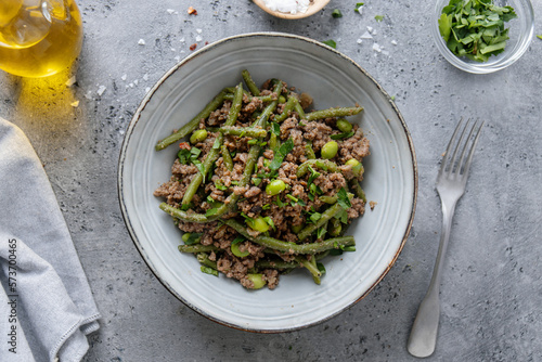 Green beans with minced meat in bowl