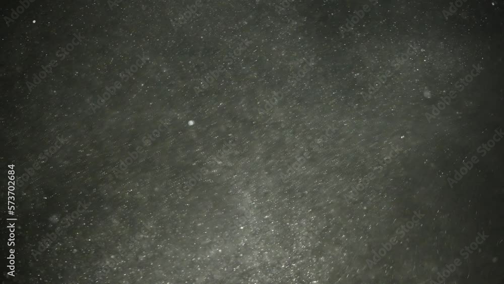 Dense sand dust particles fly through the air Dense sand dust particles fly through the air