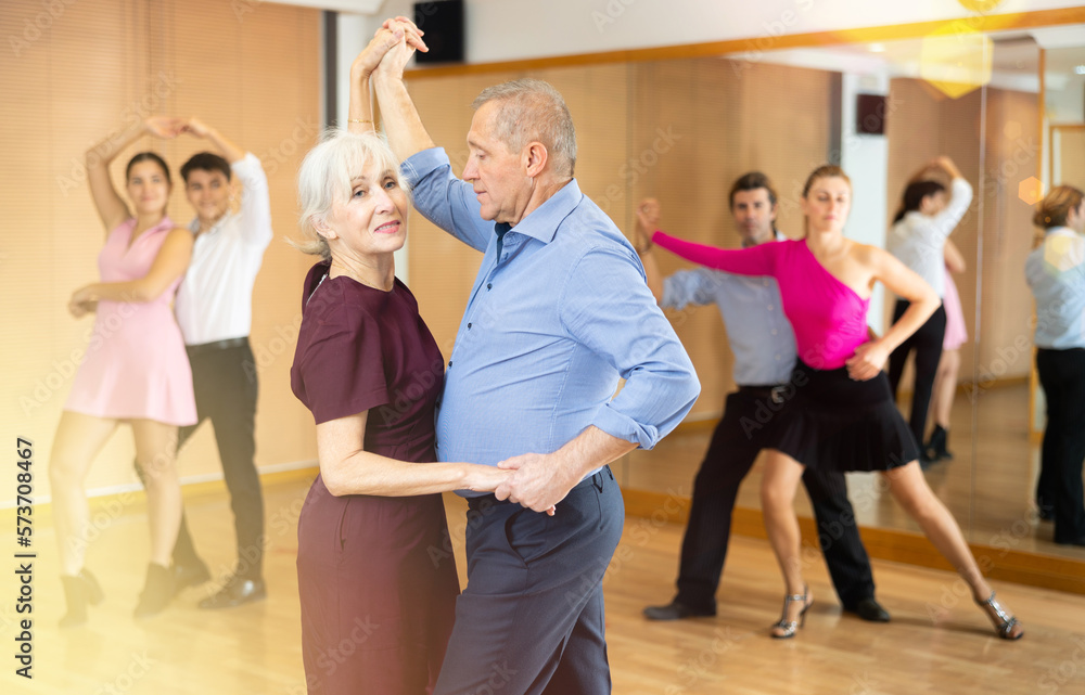 older woman dancing slow couples rumba dance with her partner