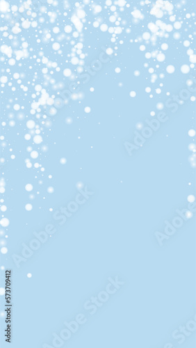 Magic falling snow christmas background. Subtle flying snow flakes and stars on light blue winter backdrop. Magic falling snow holiday scenery. Vertical vector illustration.