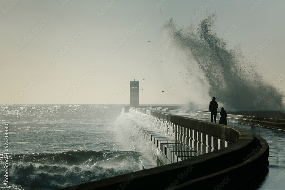The Atlantic lighthouse in bad weather. Porto, Portugal.