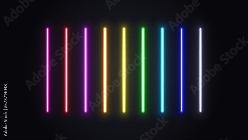 A set of neon glowing lamps. Bright multicolored lasers on a dark background.