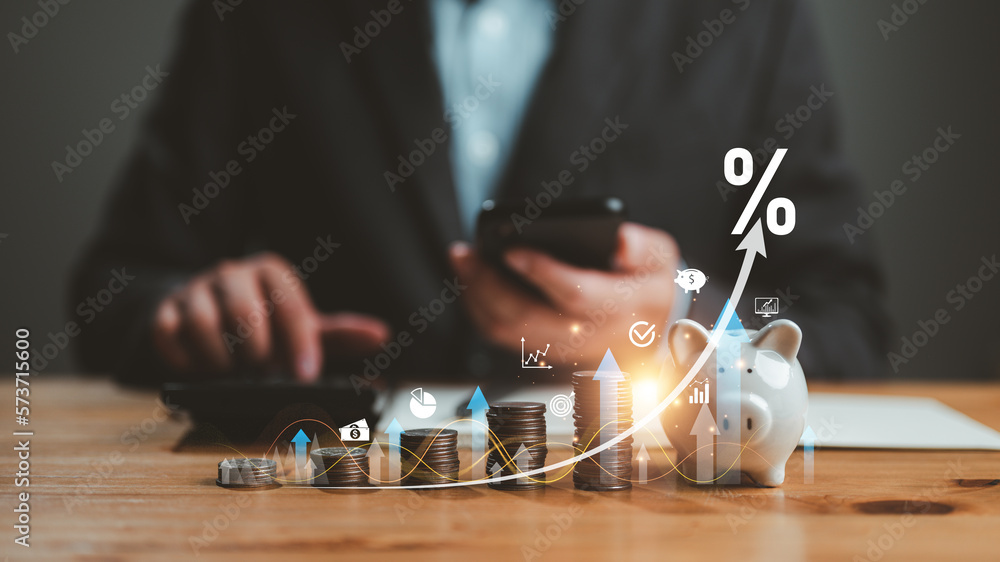 Interest rate and dividend concept, businessman calculating income and return on investment, save, income, return, retirement, compensation fund, investment, dividend tax, stock market, saving, trade. - obrazy, fototapety, plakaty 