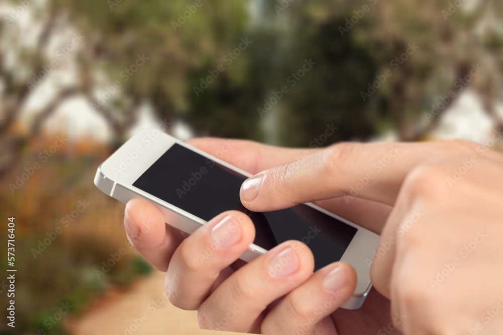 Cheerful young person using a phone